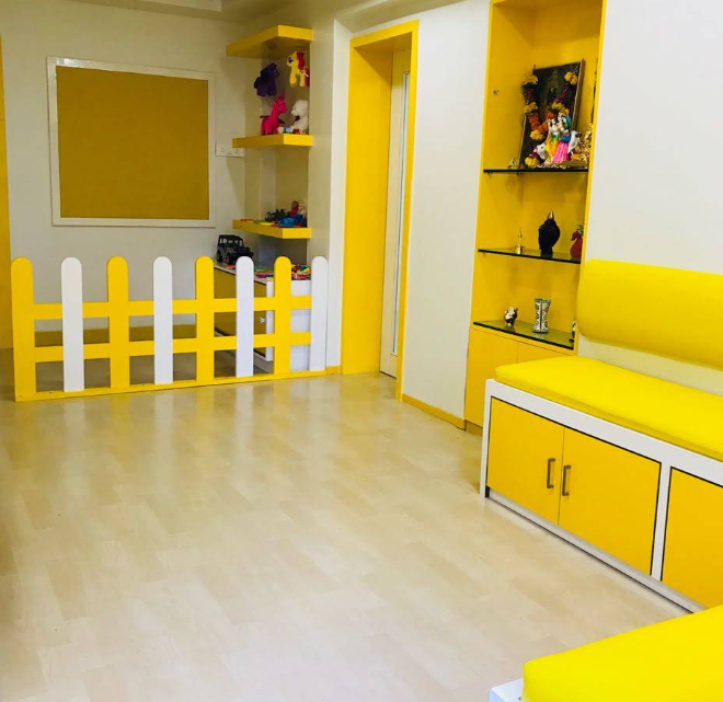 Bright yellow child-friendly waiting and play area