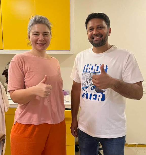 Happy patient with dentist at Shining Smiles